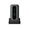 Base de téléphone fixe grise dans une station de charge, appelant Anne. Écran éclairé en vert avec une icône de téléphone.