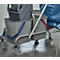 Grey cleaning cart with two buckets, blue and red handles. Behind the cart a blue garbage bag.