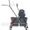 Gray cleaning cart with two buckets, a press attachment and a frame with accessories. On castors.