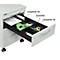 Open, white filing cabinet. Drawer with office supplies such as staplers, scissors, pens. Labeling: A4 dividers, cross and A5 dividers.