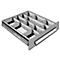 A drawer with multiple compartments, divided by partitions.
