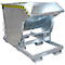 Grey metal tipper, with yellow and black warning stripes, standing on a metal frame.