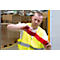 A man in a yellow vest is sticking red tape. In the background pallets and boxes.