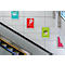 Wand mit Werbeplakaten, eine Rolltreppe im Vordergrund. Die Plakate zeigen 'Sale' Angebote.