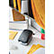 Black and gray label printer sits on a white table surrounded by envelopes, boxes and a mailbox.