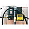 Close-up of a fuel station accessory: a black fuel nozzle, a yellow counter, hoses, and metallic components.