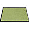 Una alfombra verde con borde negro. La superficie es suave.