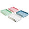 Quatre plateaux colorés : vert, rose, bleu et blanc, sur fond blanc.