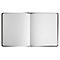 Carnet noir ouvert avec pages blanches vierges. Le dos est rouge.
