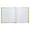 Livre ouvert avec des pages blanches vierges. La couverture verte est visible.