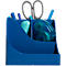 Porte-stylos bleu avec ciseaux, stylos et rouleau correcteur.