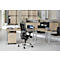 A modern office with a desk, chairs and cabinets. A laptop sits on the desk.