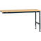 Workbench with wooden top and gray metal frame. One side is attached to the wall, the other stands on two legs.