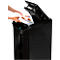 A person placing a chart into a black paper shredder. The lid is open. The paper is marked with colorful pie charts.
