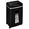 Black paper shredder with paper scraps in the collection container. Input slot on top.