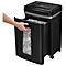 A black paper shredder with the collection container pulled out. A man's hand is emptying the container.