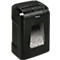 Black Fellowes paper shredder, partially filled with shredded paper, visible window.