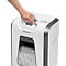 A hand presses a button on a white Fellowes paper shredder.
