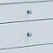 Close-up of two drawers with square, grey handles. The drawers are light blue.