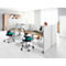 Office with multiple workstations. A woman sits at a desk, two office chairs with turquoise seats.