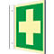 Emergency exit sign with green cross on yellow background. Mounted on white wall.