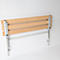Folding shower bench made of wood and metal, mounted on a white wall.
