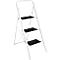 White stepladder with three black steps. It stands slightly tilted against a white background.