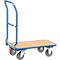 Blue painted platform trolley with four wheels and wooden top. The handle rises upwards.