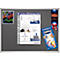 Grey magnetic board with notes and promotional materials, including a brochure, a book and a picture with vegetables.