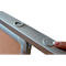 Close-up: Finger pressing a white button on a light grey frame.