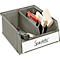 Grey toolbox with spatulas and wooden blocks. White sign with black writing says "Spatula".