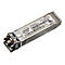 Ein metallisches Intel SFP-Transceiver-Modul mit Aufkleber und Anschlüssen vor weißem Hintergrund.