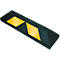 Black parking stop with two yellow diamonds. A practical accessory for parking areas.