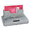 Grijze thermische bindmachine TB500 met papier in rood stippenpatroon. Inscriptie 'REPORT'.