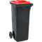 Black trash can with red lid and wheels.