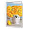 Yellow ranunculus flowers in a white, heart-shaped basket. A single bloom lies in front.