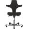 Black office chair, ergonomically shaped, on grey base, high backrest.