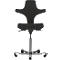Black office chair, ergonomically shaped, with castors and height-adjustable seat. Wing-shaped backrest.