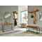 Beige bank met geribbelde zitting en zwart metalen frame.