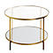 Table d'appoint dorée avec deux étagères rondes en verre. Les pieds sont également de couleur dorée.