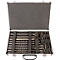 An open tool case with various drill bits and chisels, bedded in gray foam.