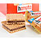 Zwei aufeinanderliegende Hanuta-Haselnusswaffeln vor einer roten Markenverpackung.