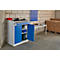 Workshop cabinet in workshop, turquoise blue door, white work surface, blue storage bins on wall.