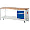 Workbench with wooden top, drawers, wheels. The workbench is white, with blue drawers and a wooden top.