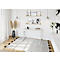 White desk with silver legs in modern home office, pictures on wall.