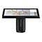Ein schwarzes Touchscreen-Display auf einem Säulenfuss, zeigt Hängelampen. Auf dem Display gibt es Auswahlmöglichkeiten für Stühle, Sofas, Tische und Lampen.