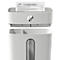 White paper shredder with HP logo, paper being shredded. The compartment below is visible for shredded paper.