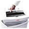 A hand lifts the top of a white paper shredder, with the collection bin below. The shredder says SECURIo C14.