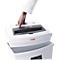 Hand lifting the lid of a white paper shredder. 'HSM' and 'SECURIO' are written on the device.