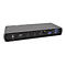 Graue Dockingstation mit zahlreichen AnschlÃ¼ssen wie USB und HDMI. Die Vorderseite ist dunkelgrau mit weiÃŸen Symbolen.